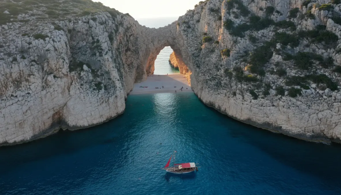 Dramatic Stiniva Beach on Vis island with towering cliffs and crystal-clear Adriatic waters